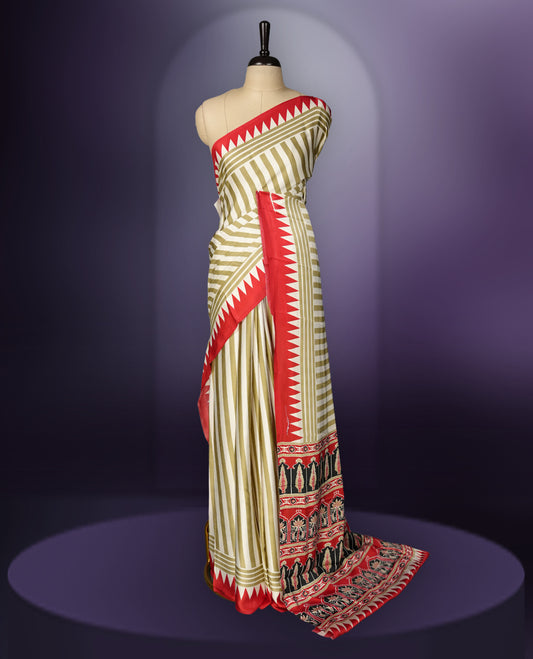 Beige colour saree with olive green stripes, highlighted by a striking red geometric border and a beautifully patterned pallu with intricate motifs, comes with a matching blouse.