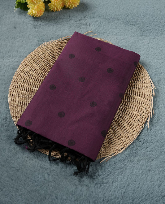 Grape Purple colour poly cotton saree with black abstract butti motifs on the body, paired with a matching pallu with dense black textured round butta pattern, and a coordinated all‑over textured round butta printed blouse piece.