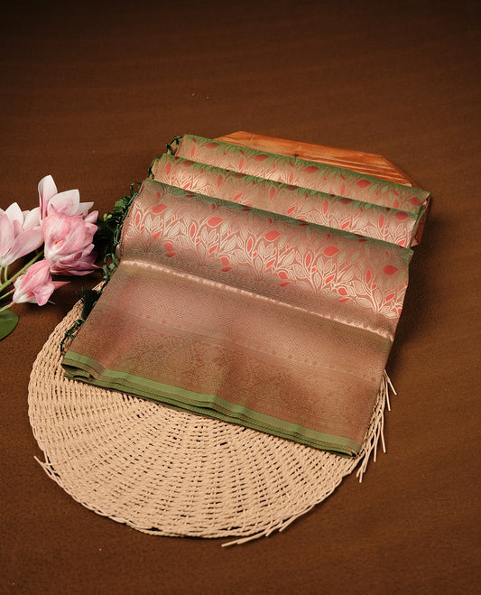 Green & Brown Dual Colour Softie Silk Saree Featuring An All Over Gold Woven Leaf Pattern, Finished With A Matching Border Adorned With Intricate Paisley And Floral Motifs, Paired With A Matching Blouse Piece.