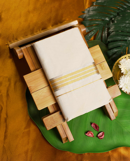 Classic off white colour pure handloom cotton double dhoti featuring a rich golden zari border with fine detailing, blending elegance and tradition. Perfect for weddings, festivals, and cultural celebrations