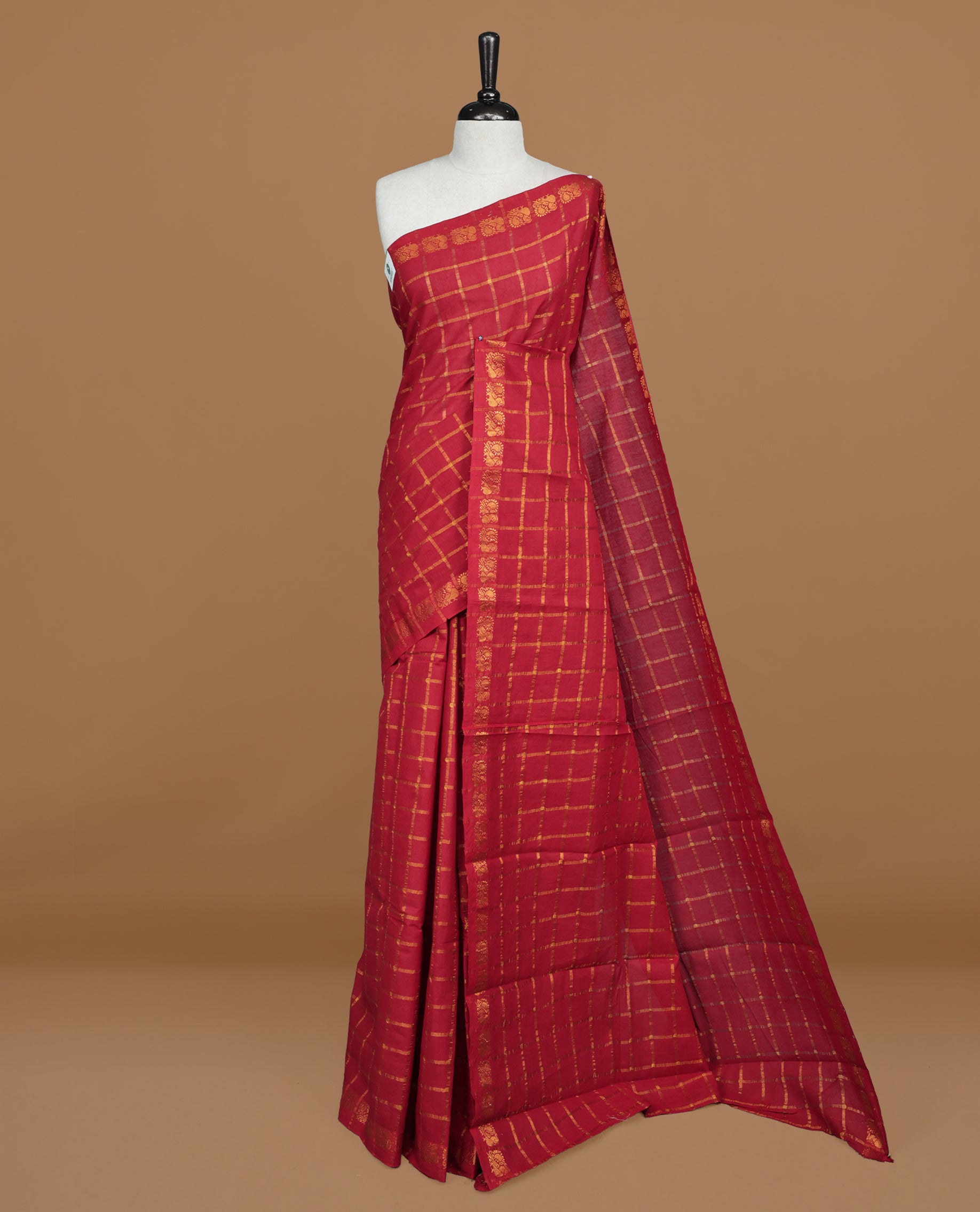 Red colour Sungudi cotton saree featuring Gold zari Check pattern on body, Gold zari Peacock design on Self colour border, paired with matching blouse piece.