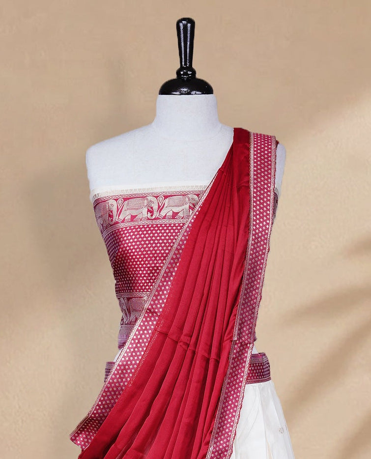 Cream colour Half saree featuring Gold zari buttas on skirt with Zari border on contrast Red colour border, Unstitched Blouse and matching dupatta.