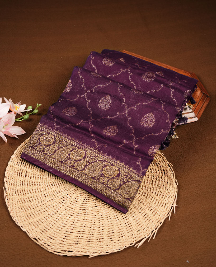 Grape purple colour semi Banaras saree with gold zari buta motifs, finished with a traditional gold zari border and pallu, paired with a matching blouse.