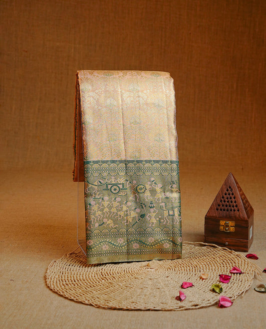 Gold & Peach colour Double shade Semi tissue silk saree featuring Gold Zari pattern on body, Contrast green colour with gold zari Tribal pattern border, paired with matching.
