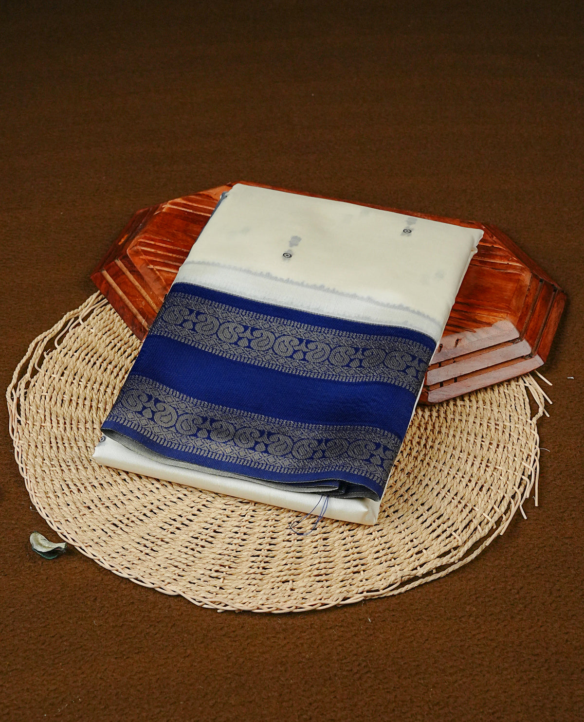 Off White Colour Semi Silk Saree Featuring Navy thread buttas On Body, Highlighted by contrast border with circle motifs, paired with matching blouse piece.