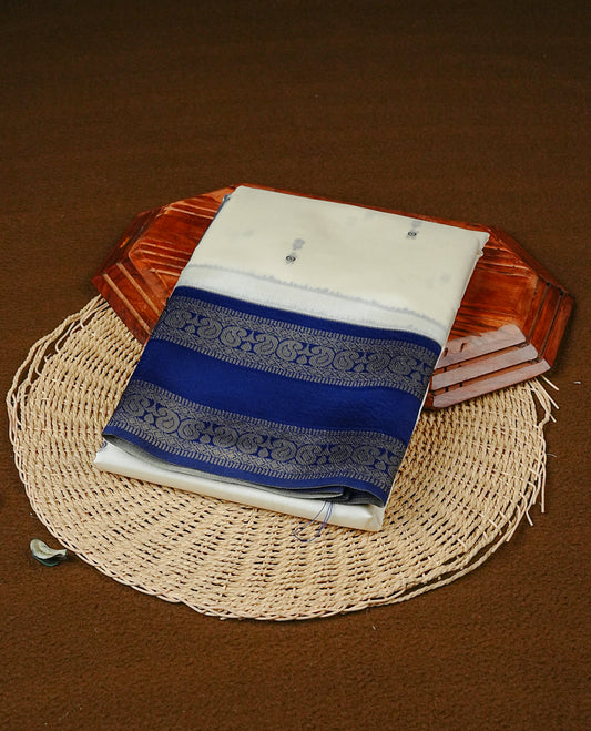 Off White Colour Semi Silk Saree Featuring Navy thread buttas On Body, Highlighted by contrast border with circle motifs, paired with matching blouse piece.