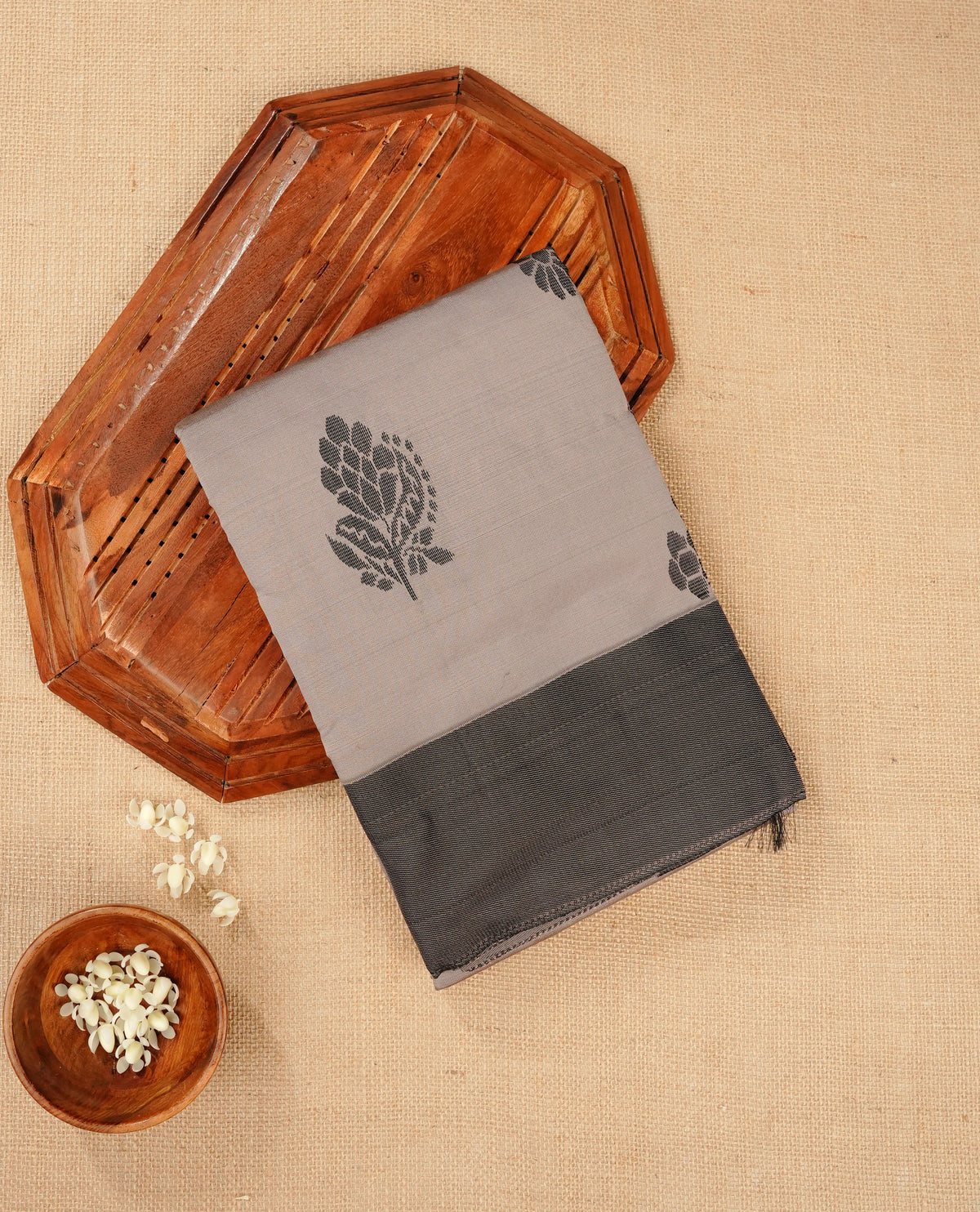 Light grey silk cotton saree featuring dark grey colour thread motifs on body thread detiled contrast borders & pallu,comes with matching blouse piece