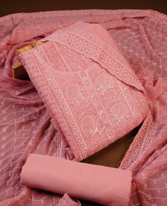 Peach colour churidhar Material featuring Intricate Thread Embroidery with Mirror and Cut Beads Work on the Front Panel, paired with an All Over Embroidered Net Dupatta and Matching Bottom