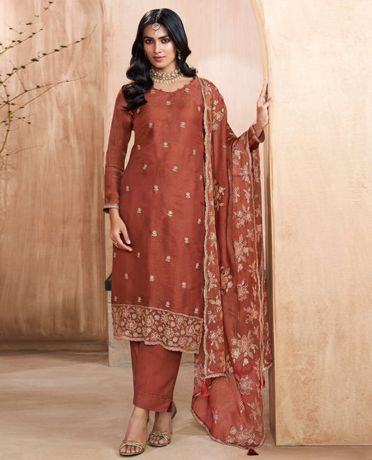Brown colour silk suit material with heavy kurta embroidery and stone work, paired with premium soft santoon bottoms and a silk dupatta detailed with rich floral kodi work