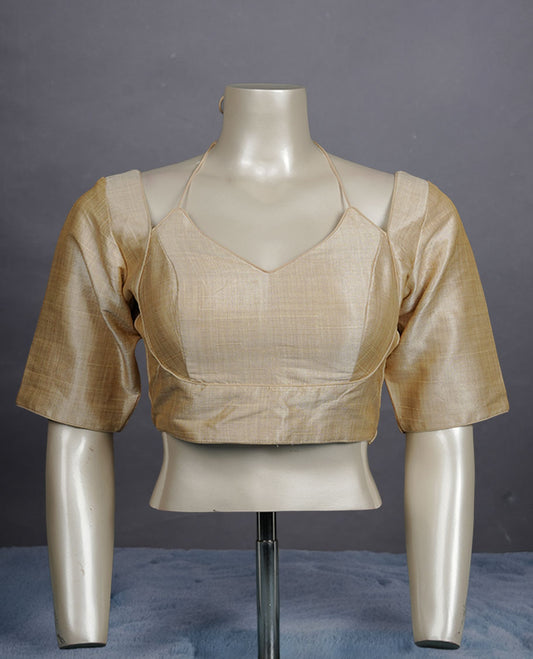 Light Cream colour silk padded readymade blouse with elbow-length sleeves, a V-neck front, and a deep U-back with tie-up dori.