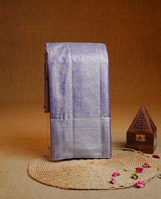 Periwinkle & Silver colour Double shade Semi tissue silk saree featuring self color kodi pattern on body, self colour with traditional border, paired with matching.