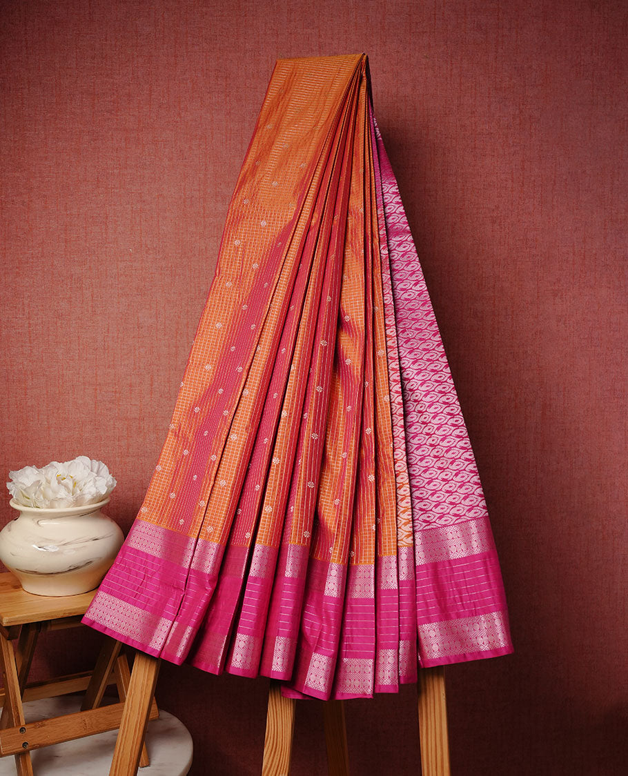 Orange colour soft silk saree featuring Gold zari check & motifs on body, complemented by contrast magenta colour with traditional border, paired with matching blouse piece.