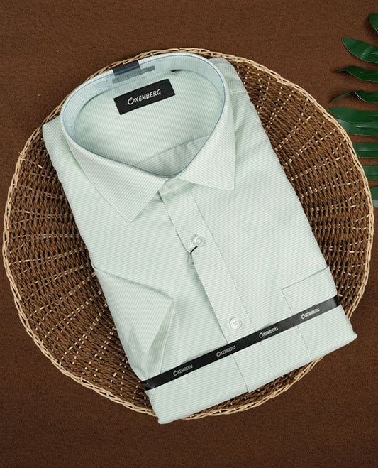 Light mint green colour long sleeve shirt with a subtle dotted pattern, Features a classic collar, front button closure, and single chest pocket & Made from smooth, breathable fabric.