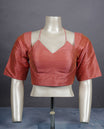Peach colour colour silk padded readymade blouse with elbow-length sleeves, a V-neck front, and a deep U-back with tie-up dori.