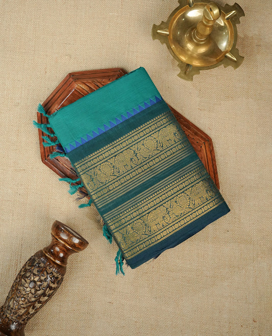 Teal colour chettinad cotton saree featuring Elegant plain body,Contrast Dark green colour with Gold zari border, comes with matching blouse piece.