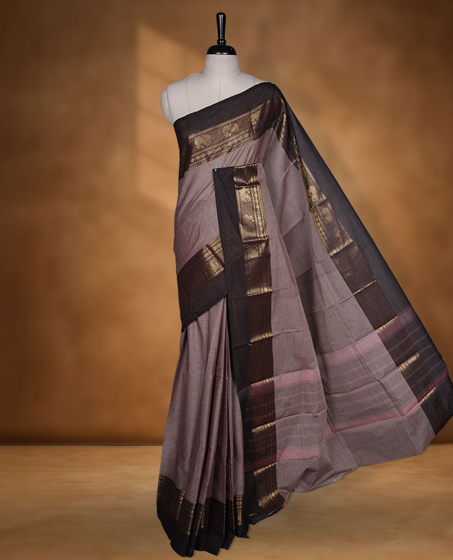 French beige colour chettinad cotton saree featuring plain body, contrast chocolate brown colour with traditional gold zari border without blouse.