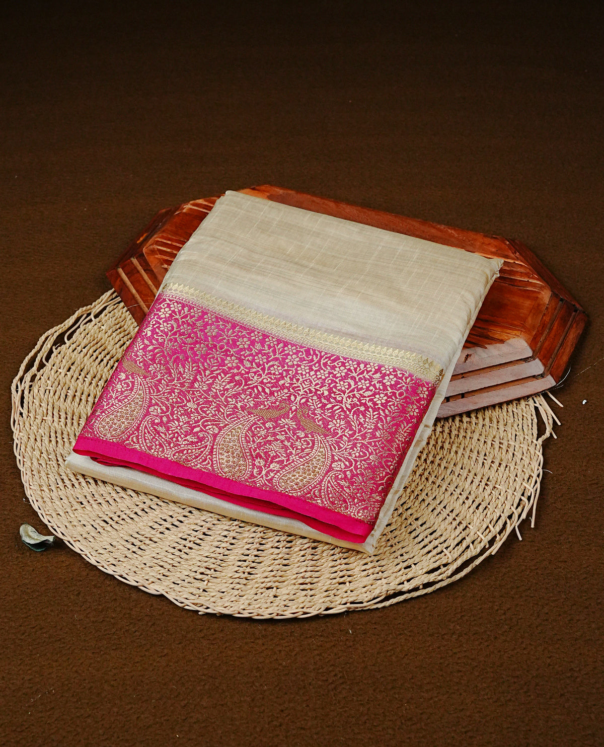 Light gold tussar saree featuring Elegant plain body, complemented by contrast Magenta colour with Gold zari Floral kodi with Peacock Pattern border, comes with matching blouse piece.