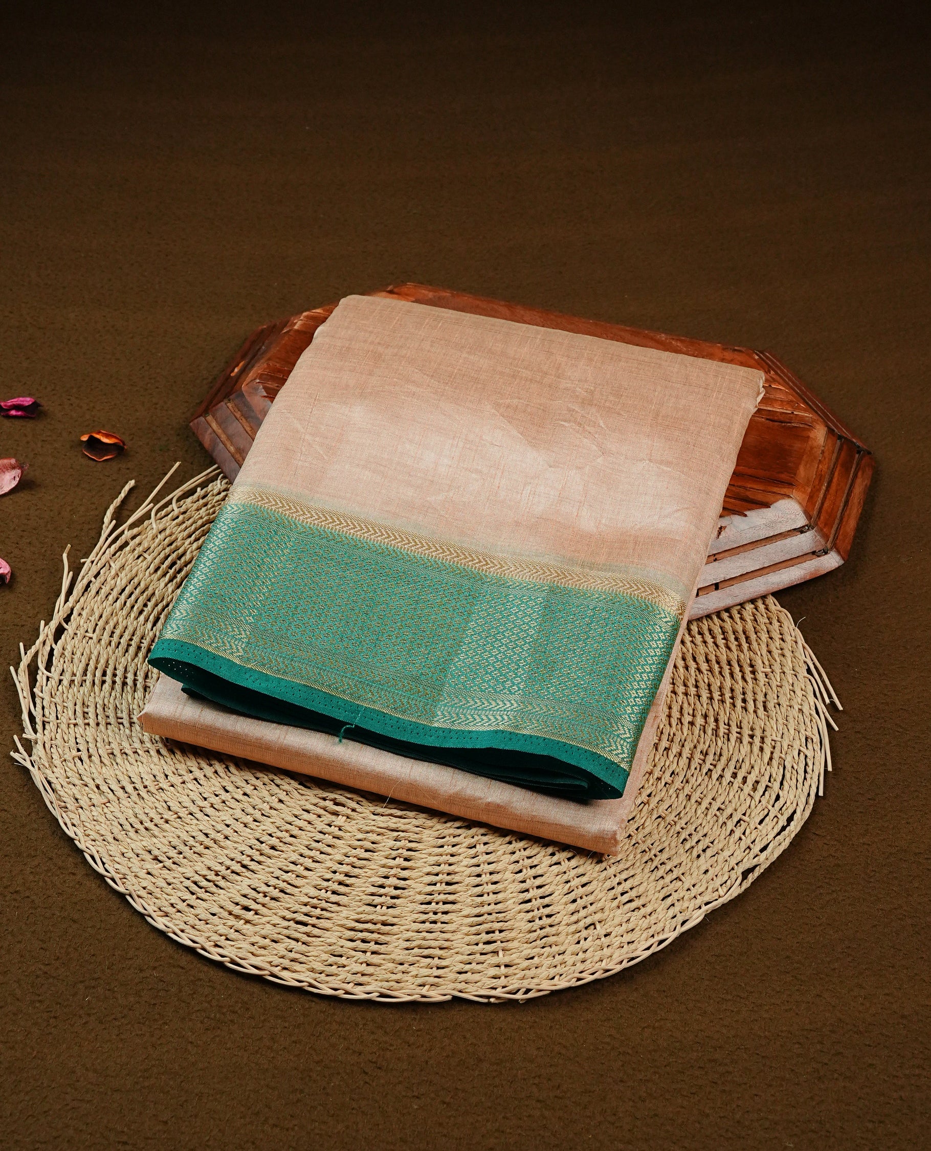 Light Gold Tussar saree featuring Gold zari buttas on body, complemented by contrast Green Colour with Gold zari border, comes with matching blouse piece.