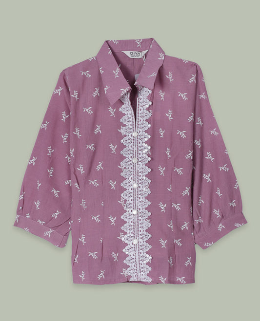 Dusty mauve printed shirt top with collared neckline, three-quarter sleeves, and front lace-trimmed button placket.