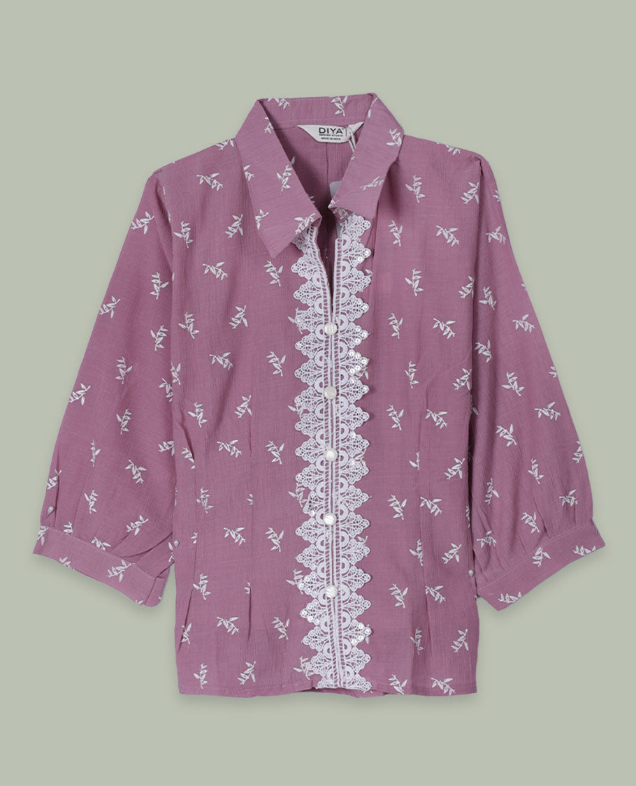 Dusty mauve printed shirt top with collared neckline, three-quarter sleeves, and front lace-trimmed button placket.