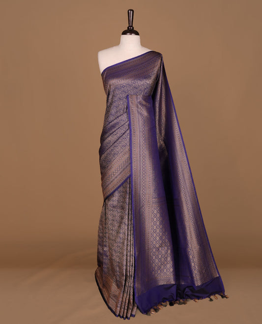 Navy blue colour semi banaras katan saree featuring Gold zari Pattern across body, complemented by self colour with zari border, paired with matching blouse piece.