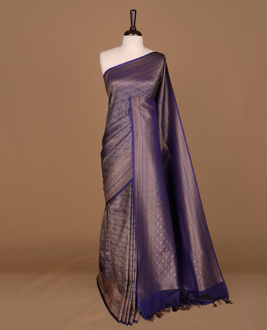Navy blue colour semi banaras katan saree featuring Gold zari Pattern across body, complemented by self colour with zari border, paired with matching blouse piece.