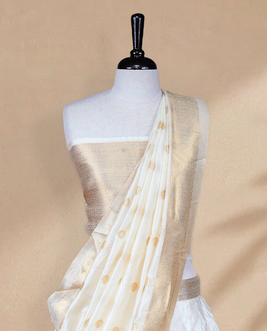 Cream colour Half saree featuring Plain skirt with Zari border on Self colour border, Unstitched Blouse and matching dupatta.