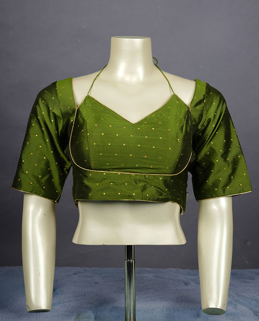 Fern Green colour padded blouse with gold polka dots, V neckline, elbow sleeves, and deep tie-up back.