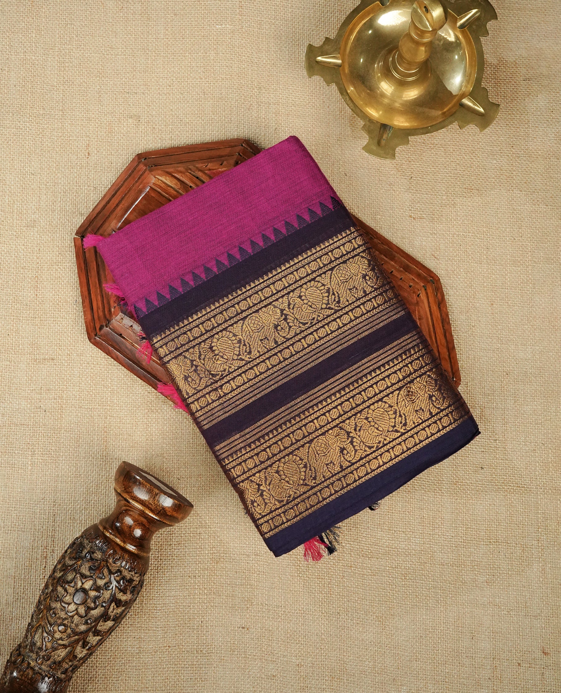 Rani pink  colour chettinad cotton saree featuring Elegant plain body,Contrast Grape colour with Gold zari border, comes with matching blouse piece.