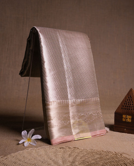Silver colour Pure banaras tissue silk saree featuring Silver zari brocade design across body, with contrast pink colour with gold zari brocade border, finished with a matching blouse.