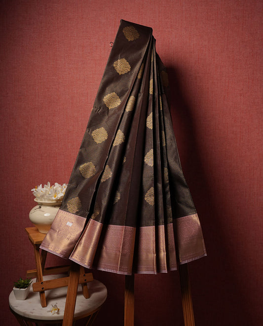 Brown colour semi silk saree highlighting gold zari check strippes and motifs across body, featuring contrast lavender colour border with gold zari pattern, comes with matching blouse .