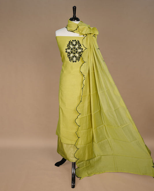 Lemon colour churidari material featuring black thread pattern on body, paired with matching bottom and dupatta.