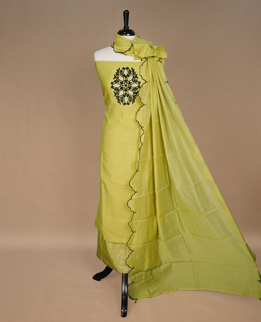 Lemon colour churidari material featuring black thread pattern on body, paired with matching bottom and dupatta.