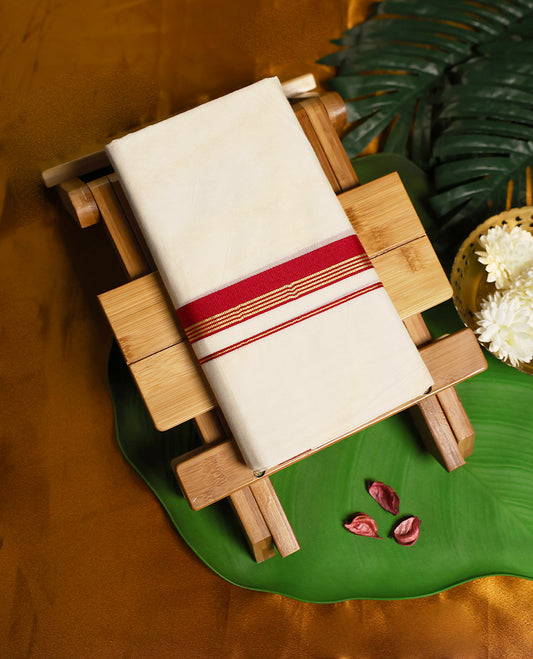 Ivory pure cotton double dhoti highlighted with a bold deep red zari border, blending traditional grace with breathable comfort, making it a perfect choice for rituals, temple visits, weddings, and festive wear.