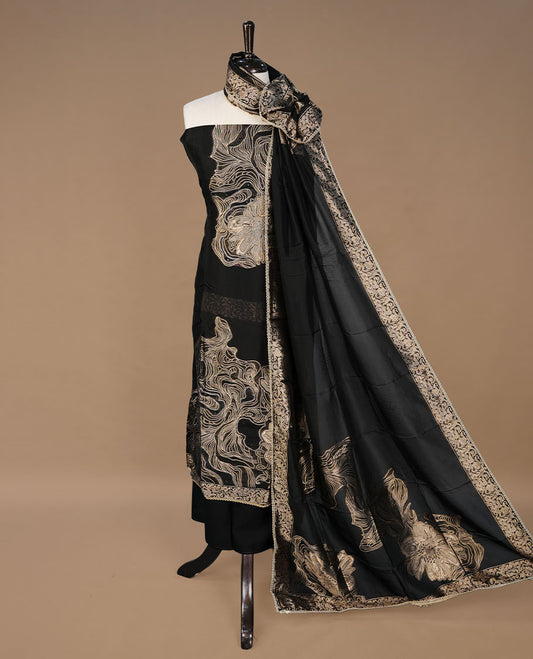 black colour churidhar material featuring gold thread pattern on body, paired with matching bottom and Dupatta.