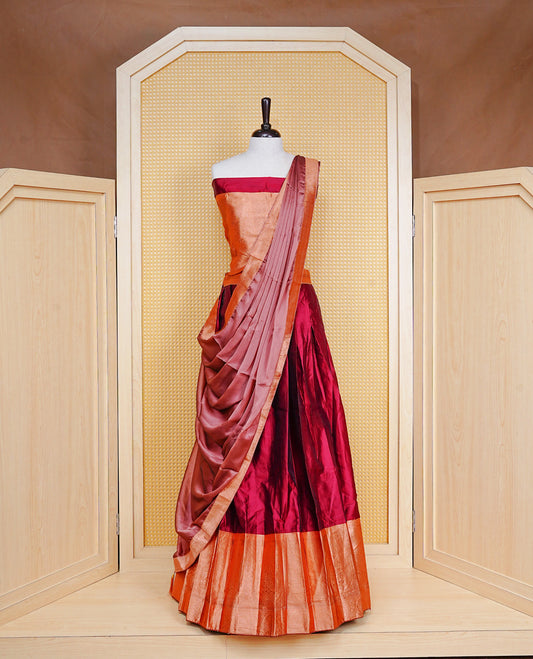 Maroon colour Half saree featuring Plain skirt with Zari border on contrast Bronze colour border, Unstitched Blouse and matching dupatta.