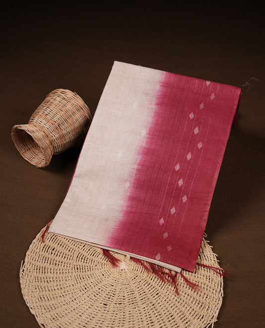 Cream & Red dye pattern colour semi jute saree highlighting white stripped body, without border and paired with matching blouse.
