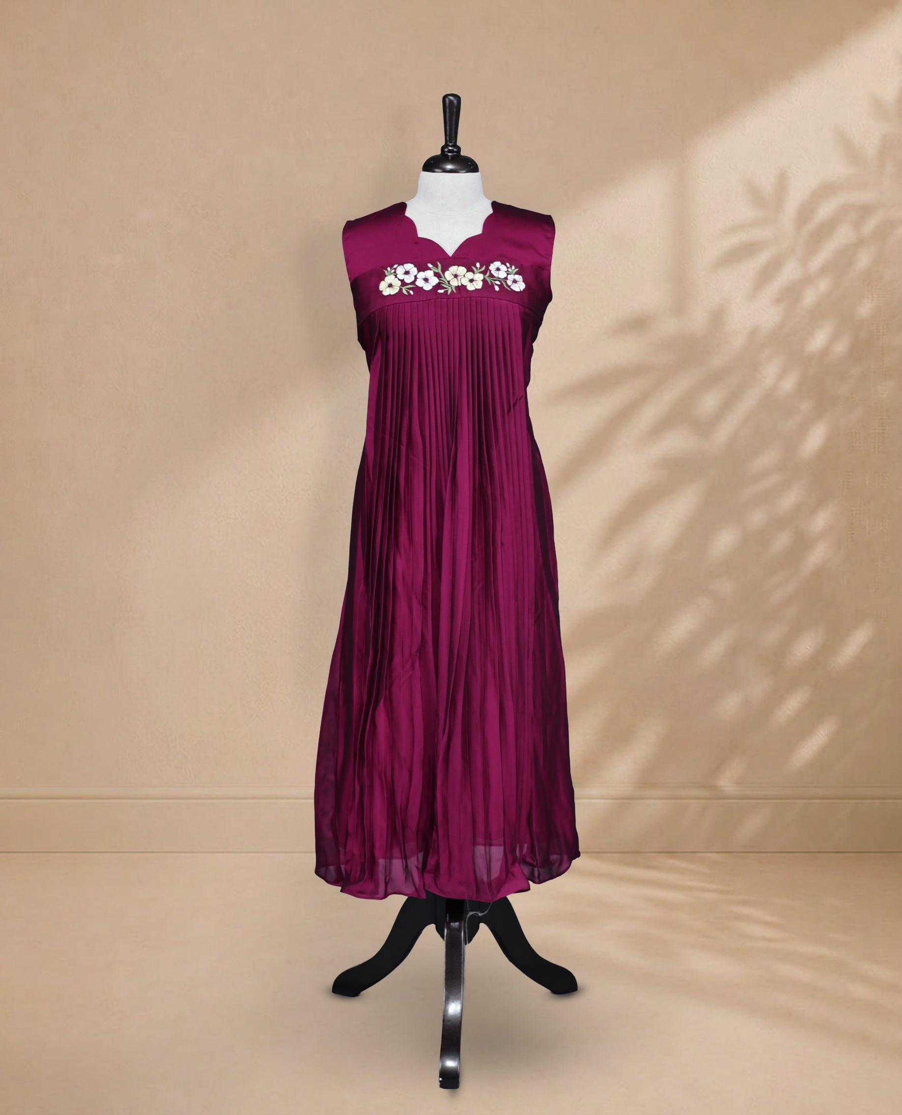 Wine  Coloured Sleeveless Kurti Featuring a Designed Neckline, Floral Embroidery on the Body
