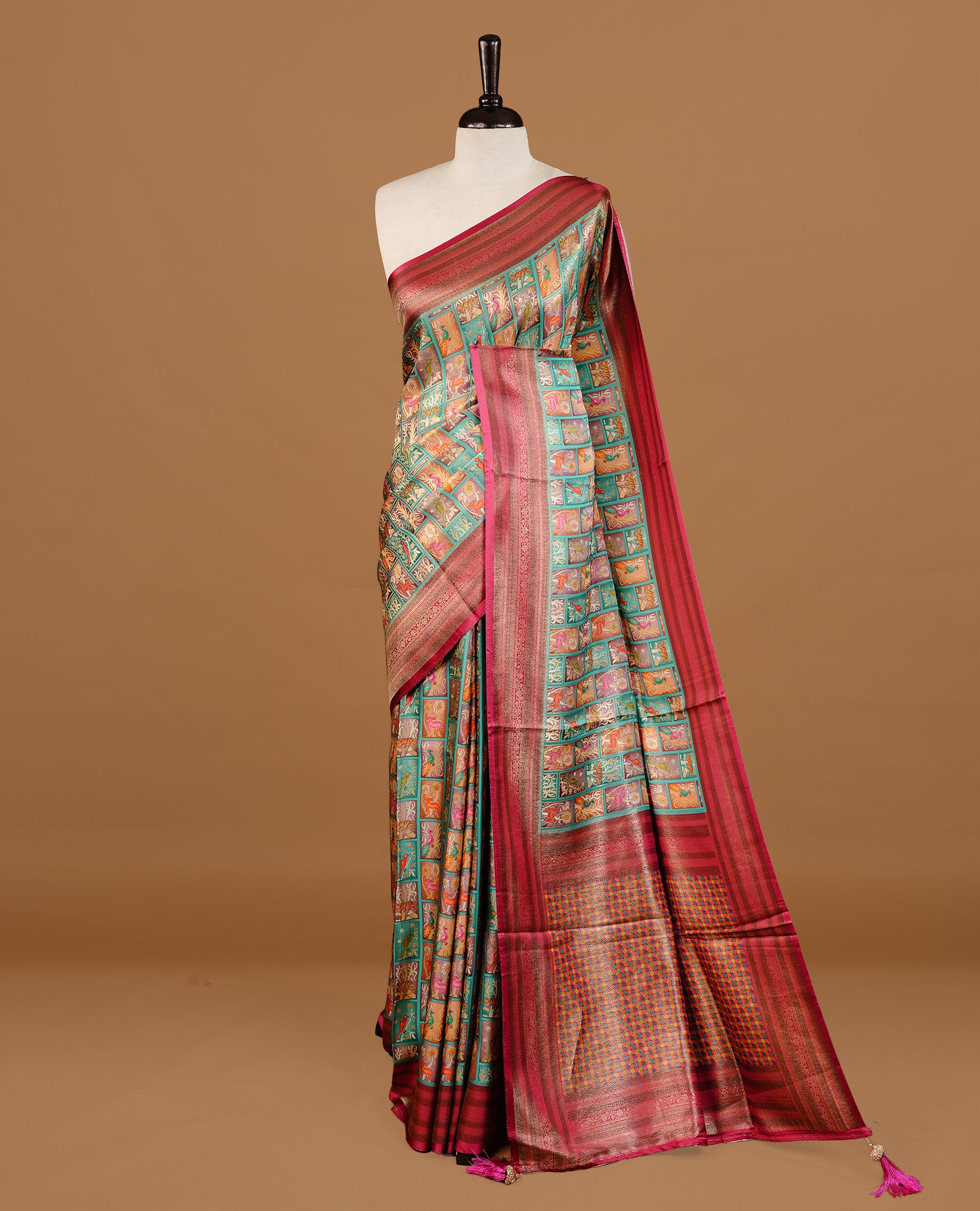 Sea Green colour Pashmina Saree featuring multicolour woven square motifs across the body, enhanced with a contrast magenta zari border and rich woven pallu, paired with a matching blouse piece.