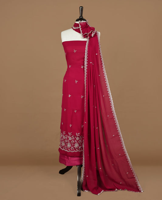 Falu red colour churidhar material featuring gold thread floral pattern on body, paired with matching bottom & dupatta.