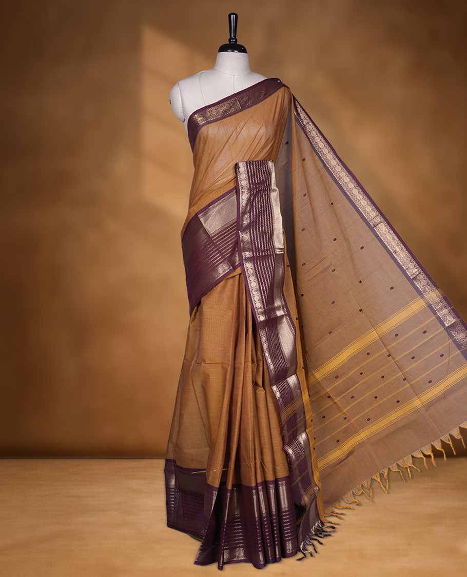 Mustard colour chettinad cotton saree featuring maroon colour motifs on body, contrast maroon colour border with gold zari border, pallu and paired with matching blouse