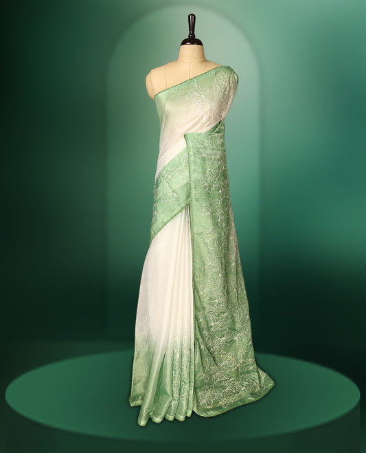 Light Green and White colour saree featuring delicate floral threadwork on the border and pallu, with a subtle ombre effect on the body, paired with a matching blouse