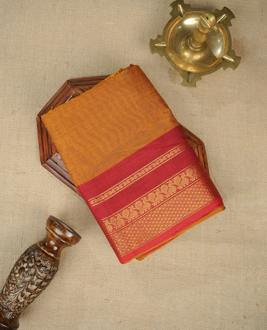 Mustard Yellow Colour Chettinad Cotton Saree Featuring a Plain Body, Complemented by a Red Colour Border with Gold Zari and a Contrast Striped Pallu, Paired with a Matching Blouse Piece.