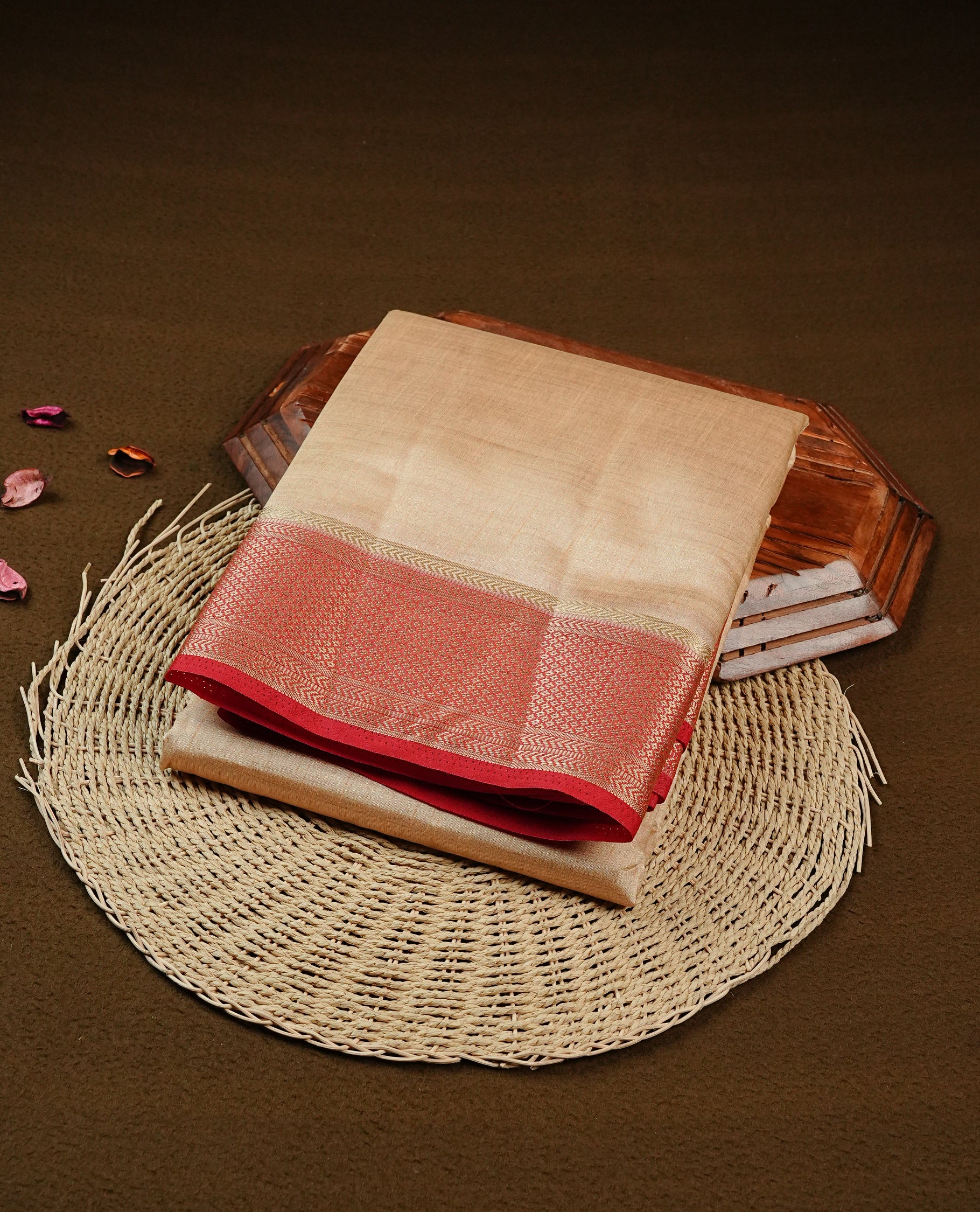 Light Gold Tussar saree featuring Gold zari buttas on body, complemented by contrast Red Colour with Gold zari border, comes with matching blouse piece.