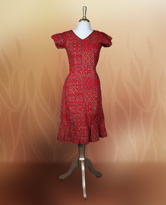 Red colour nightwear with traditional patch style prints in black and white, Features a V neck, puff sleeves, and a ruffled flared hem, A stylish pick for festive occasions, casual wear, or ethnic flair.