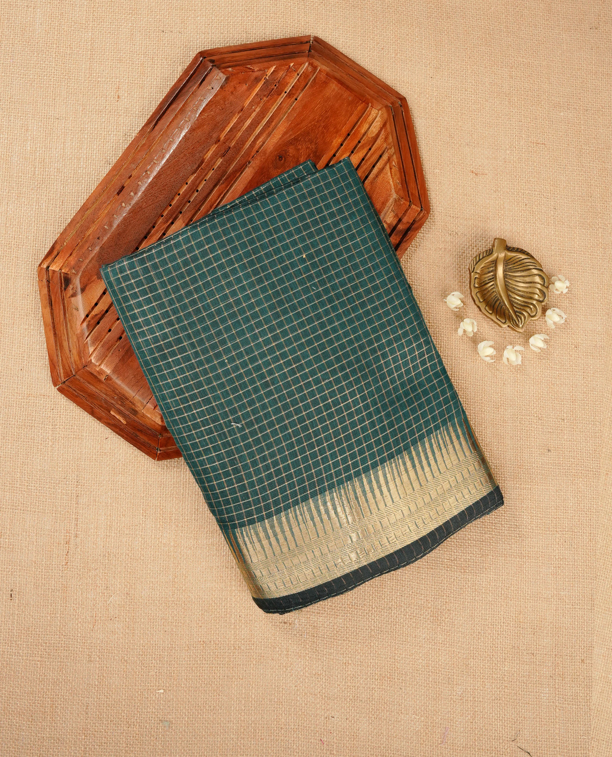 Green colour Maheshwari cotton saree, gold zari small checks on body, complement self colour gold zari temple design border comes with matching blouse.