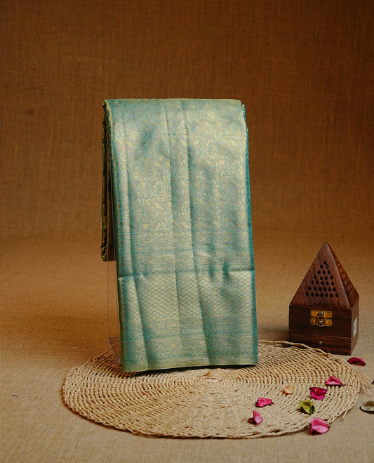 Green & Gold colour Double shade Semi tissue silk saree featuring self color kodi pattern on body, self colour with traditional border, paired with matching.