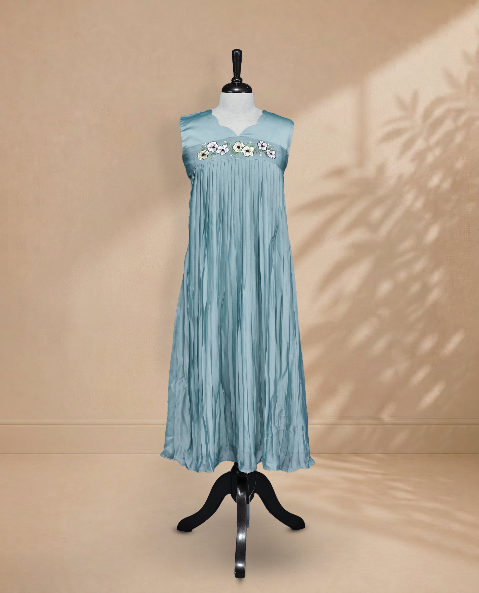 Dusty Blue Coloured Sleeveless Kurti Featuring a Designed Neckline, Floral Embroidery on the Body