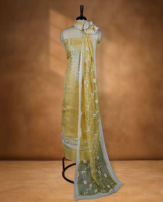 Yellow colour churidar set with off white thread embroidery and pearl detailing, paired with cotton matching pant and dupatta.