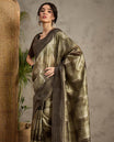Olive Green toned semi Tussar saree featuring contemporary fancy prints across the body, enhanced with a subtle Katha style stitched border, paired with a matching blouse for a stylish and elegant ethnic look.